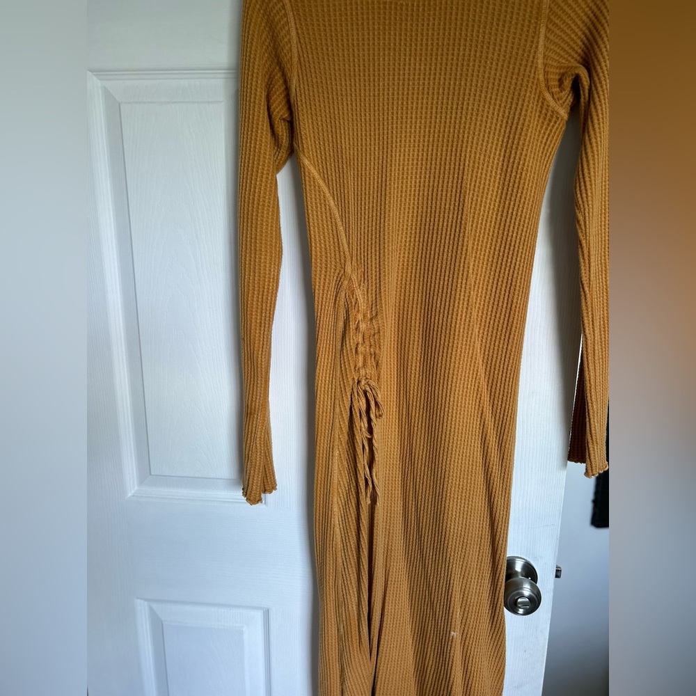 Worn once women’s size xs mustard color dress.  Waffle knit material.